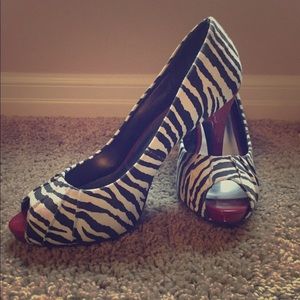 Peep toe platform heels in zebra print